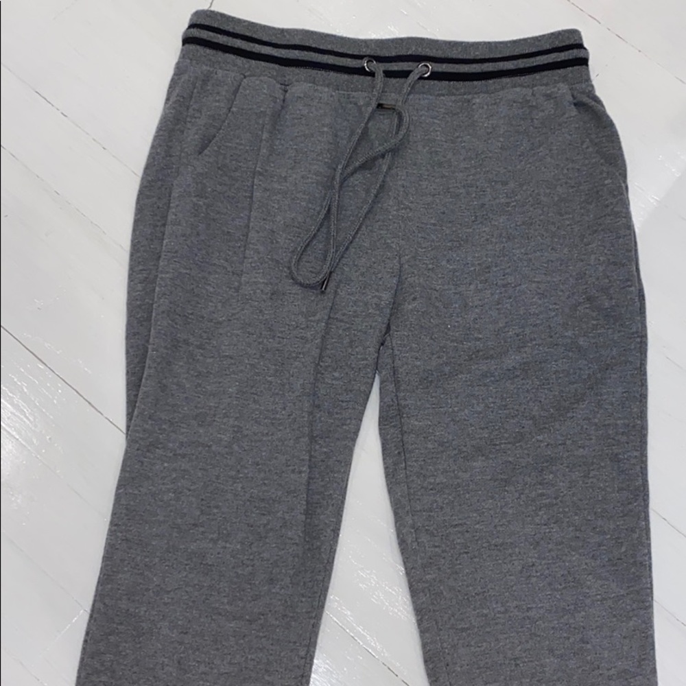Grey joggers with black stripe on waist and ankle
